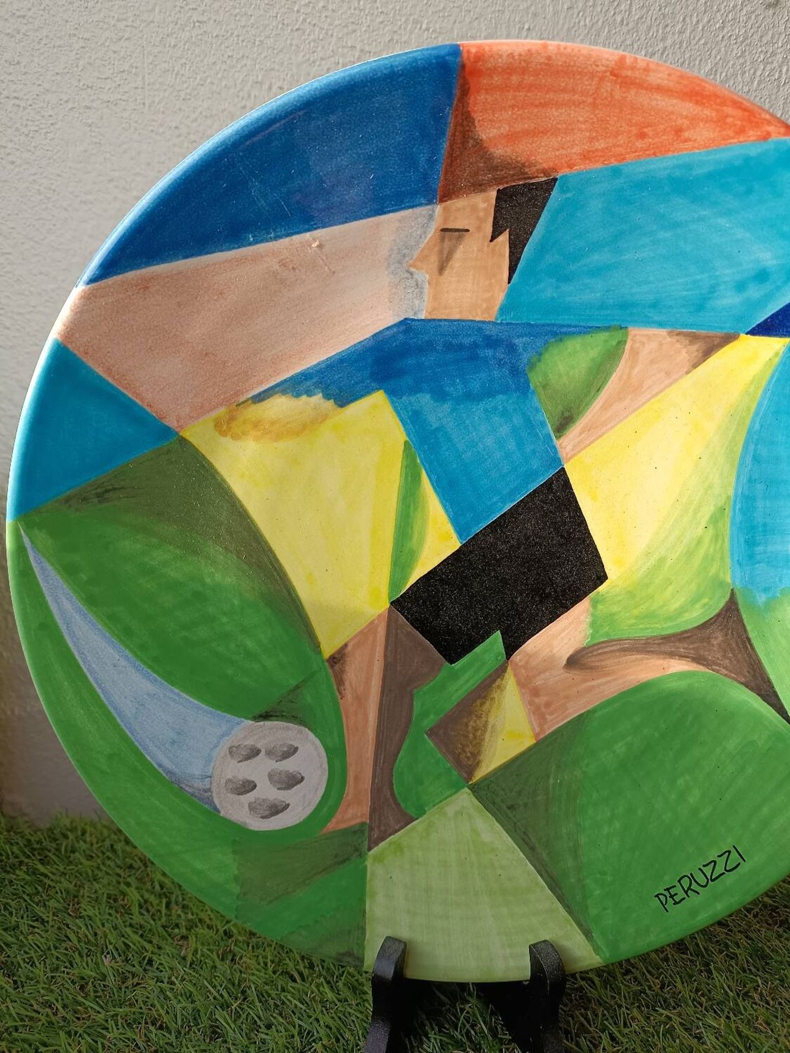 Osvaldo Perruzzi designer of polychrome faience plates.