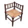19th-century turned wooden corner chair with rush seating.