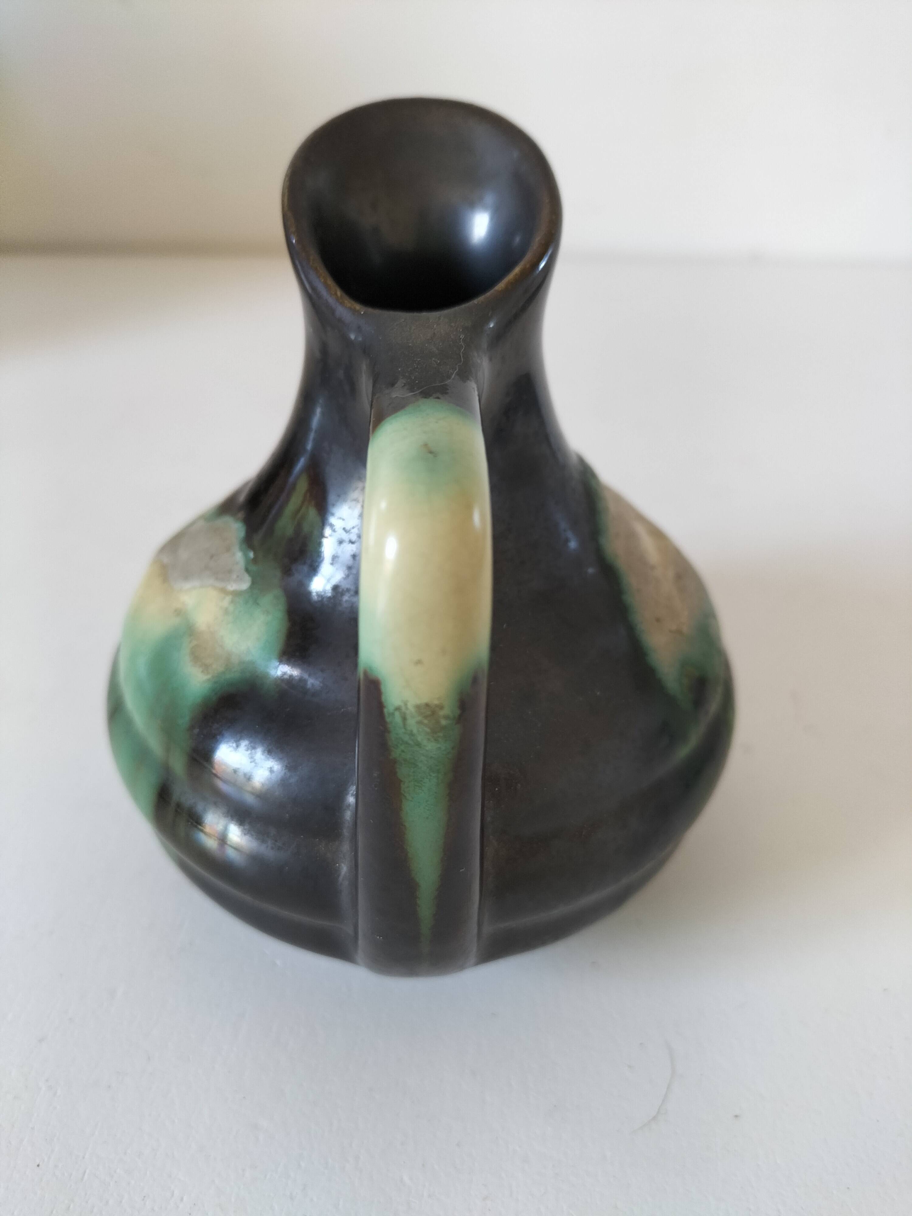 Ceramic pitcher Thulin Belgium flamed green black enamel