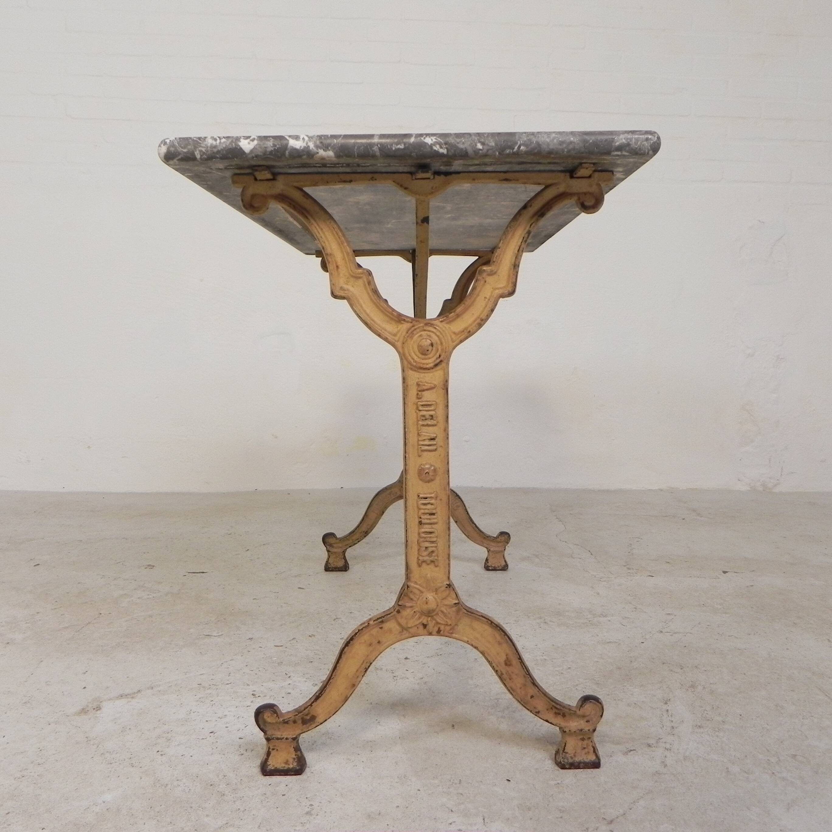 Bistro table marked A.Delail Toulouse in cast iron and marble, 1920