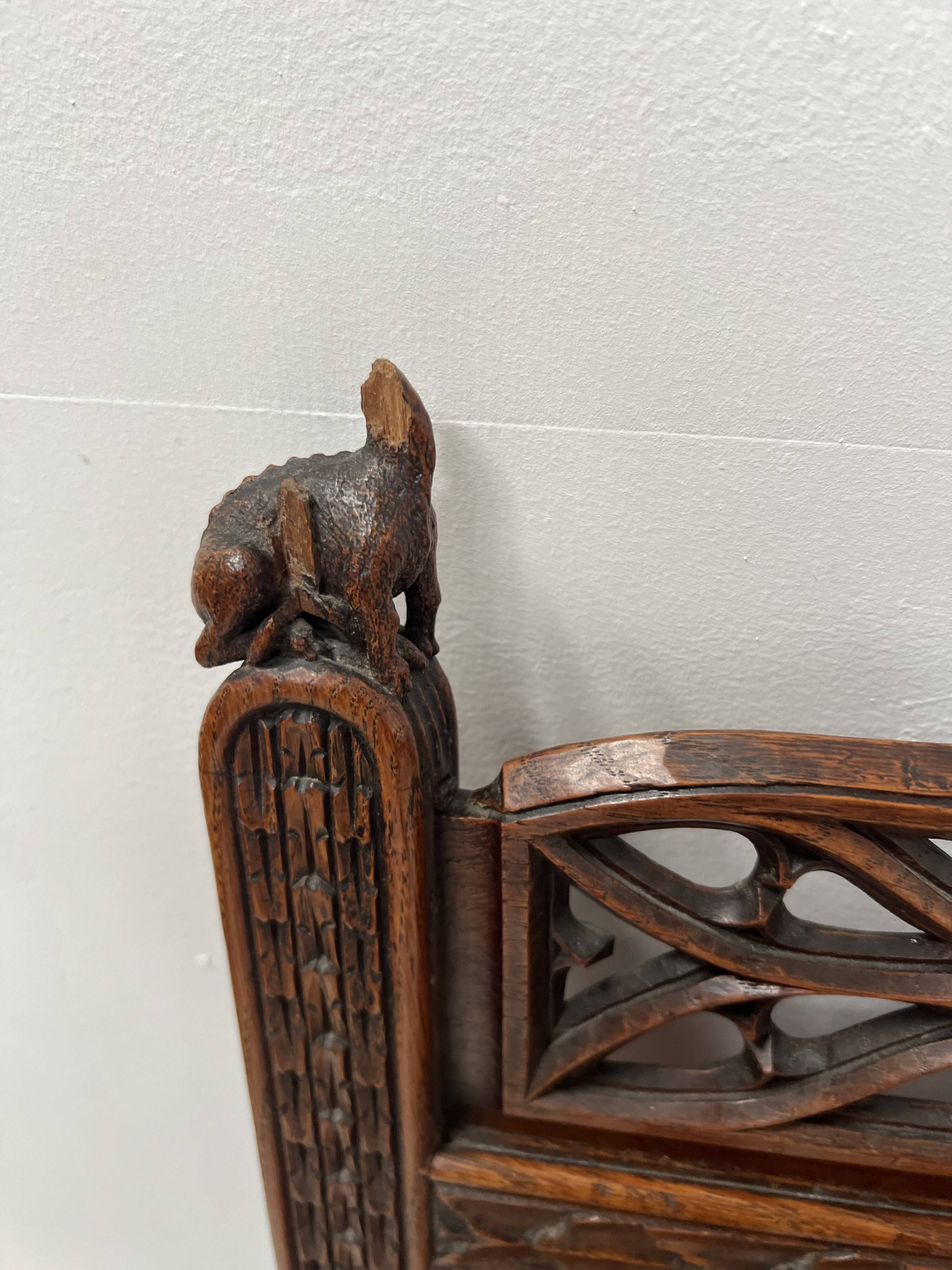 Pair of Gothic-style walnut lounge chairs, 19th century
