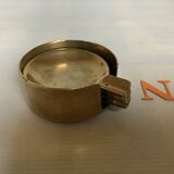 Four individual brass ashtrays