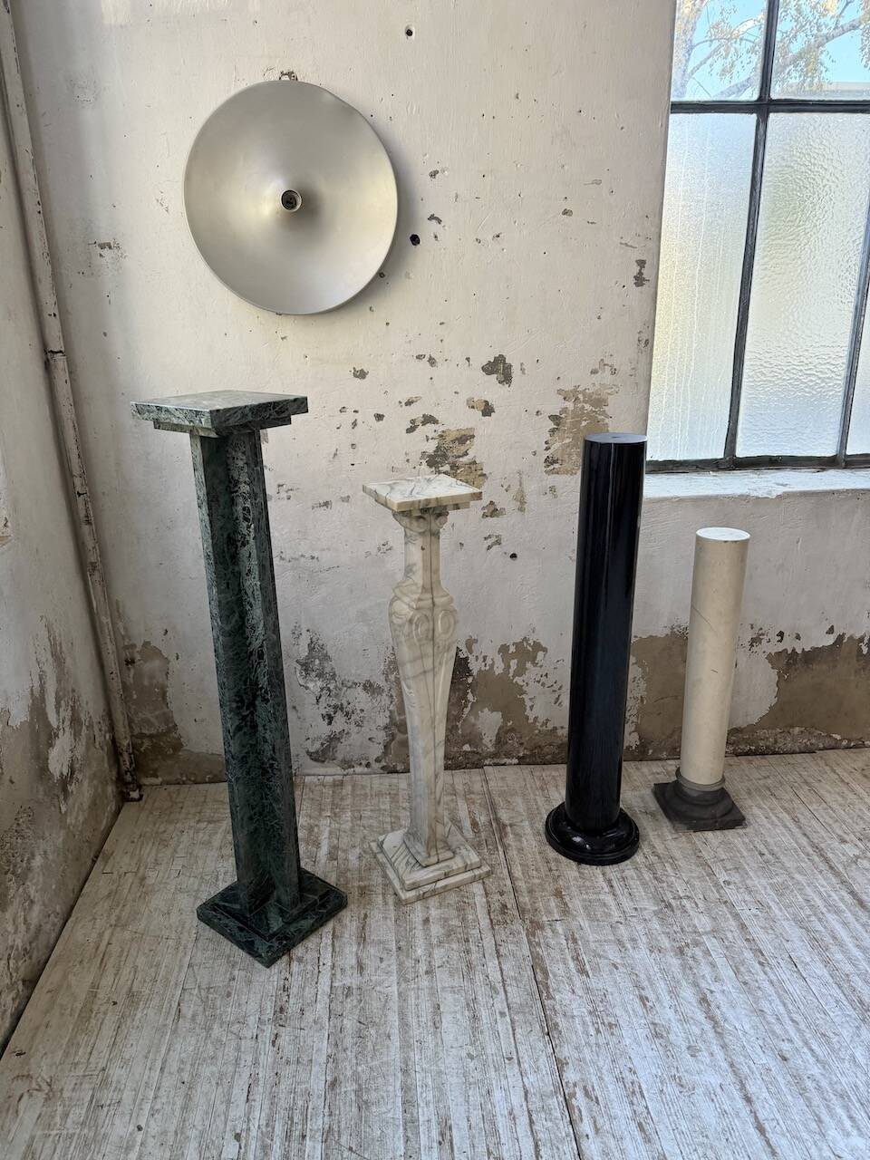 Set of 4 marble columns or pedestals.