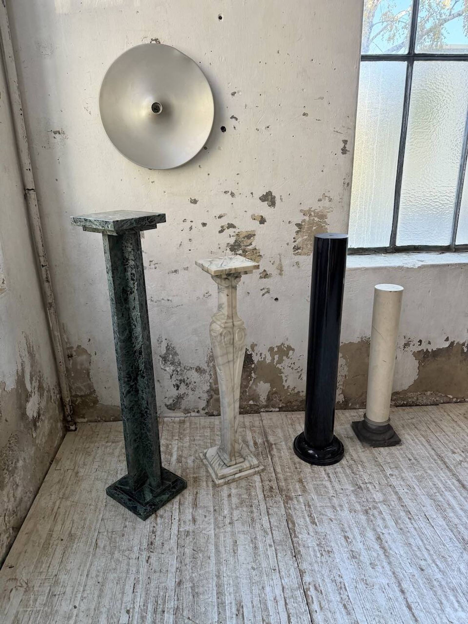 Set of 4 marble columns or pedestals.