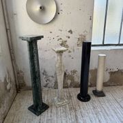 Set of 4 marble columns or pedestals.