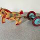Vintage pull-along toy, horse-drawn with a bell, musical toy