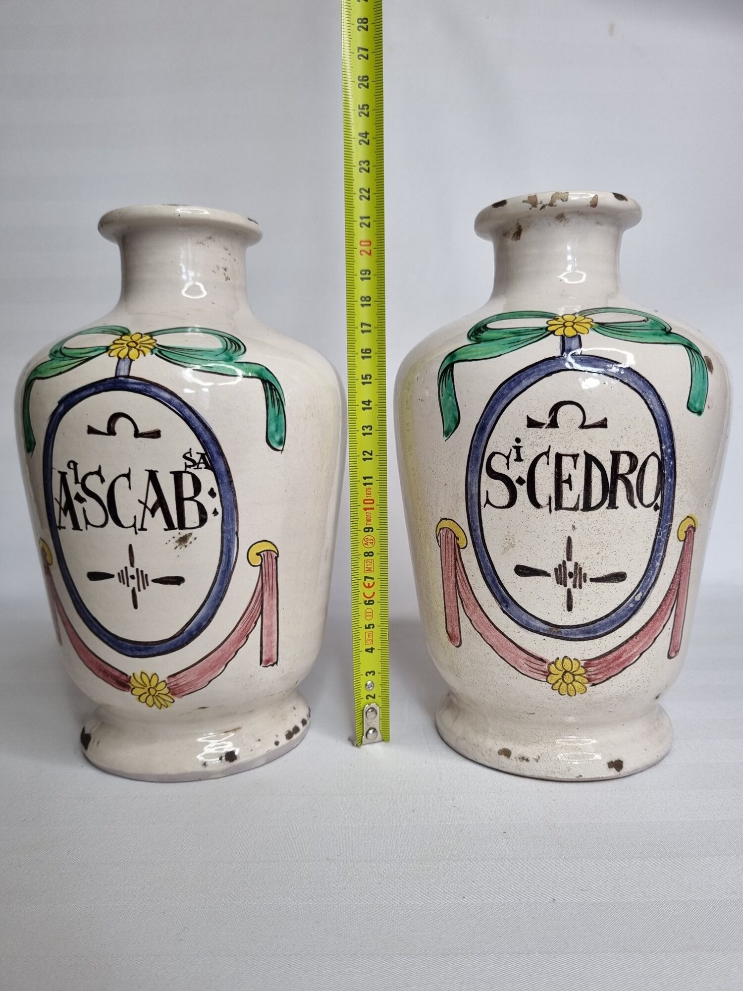 Pair of antique apothecary pots in glazed ceramic, decorated by hand