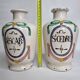 Pair of antique apothecary pots in glazed ceramic, decorated by hand