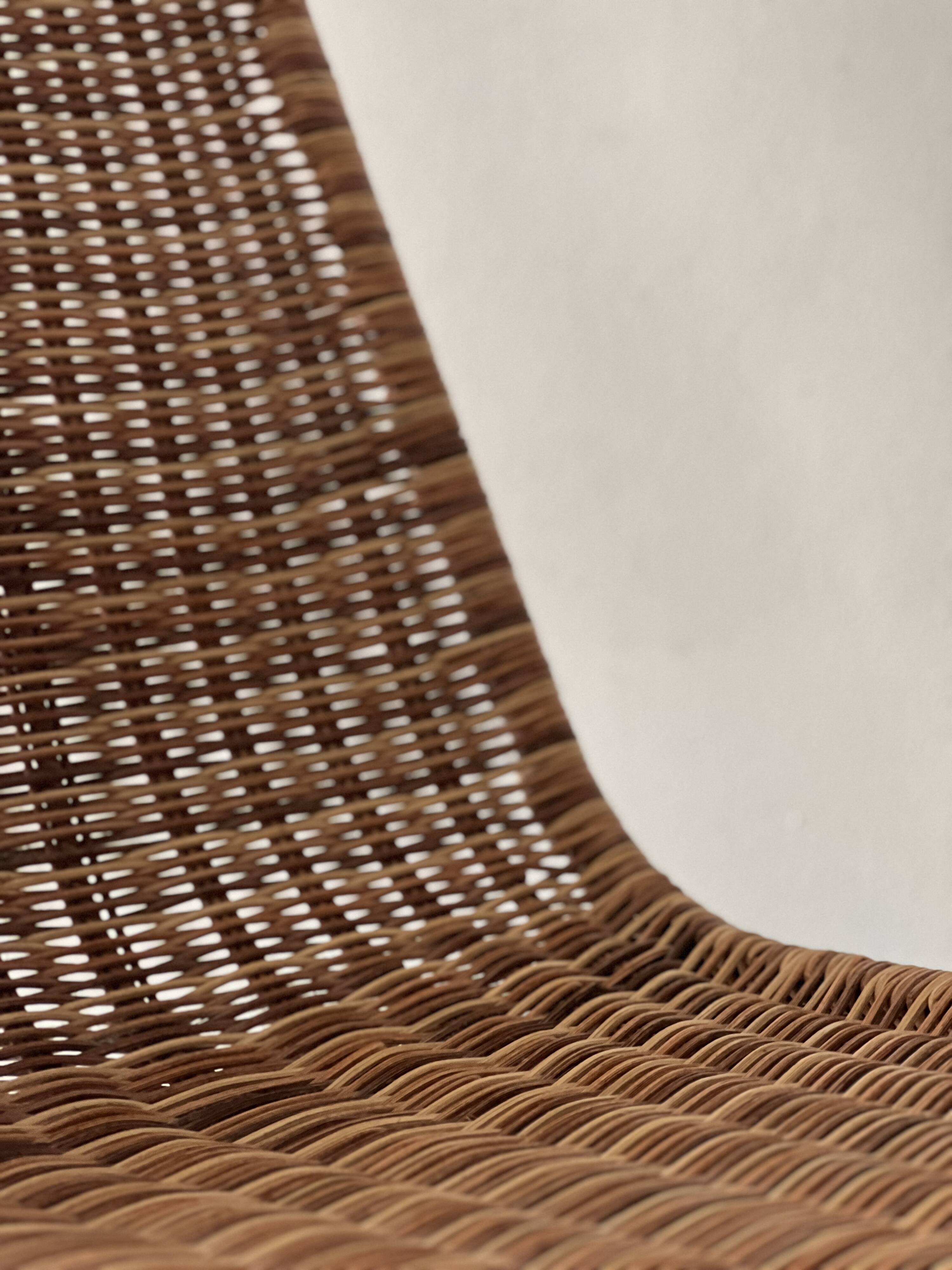 Chair made of rattan, wicker and chrome-plated metal