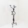 Large wrought iron candelabrum with an abstract design and three candle holders.