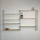 Vintage Nisse Strinning wall rack with 7 off-white shelves
