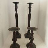 Two pairs of patinated brass candle holders