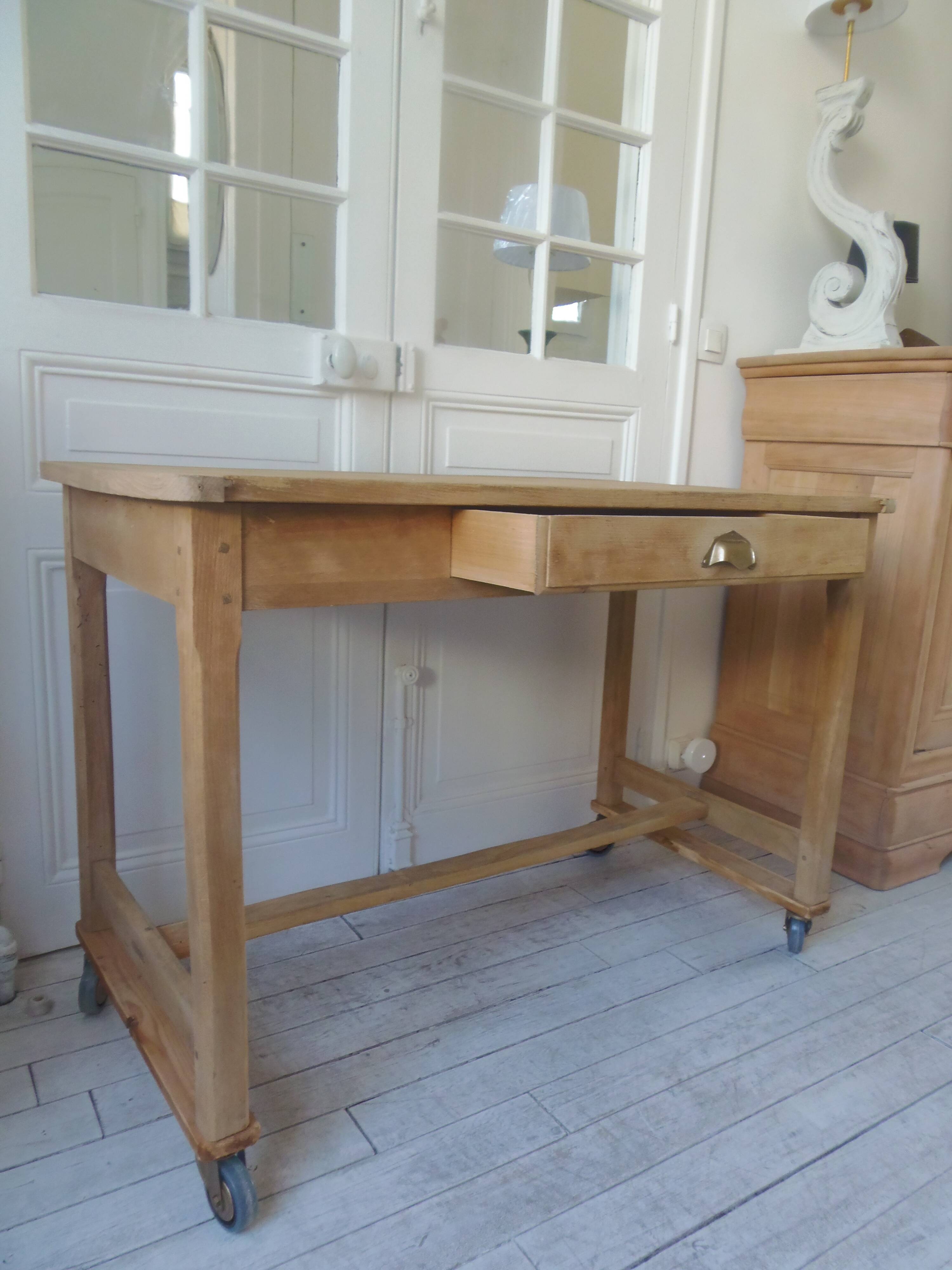 Vintage kitchen table on casters.