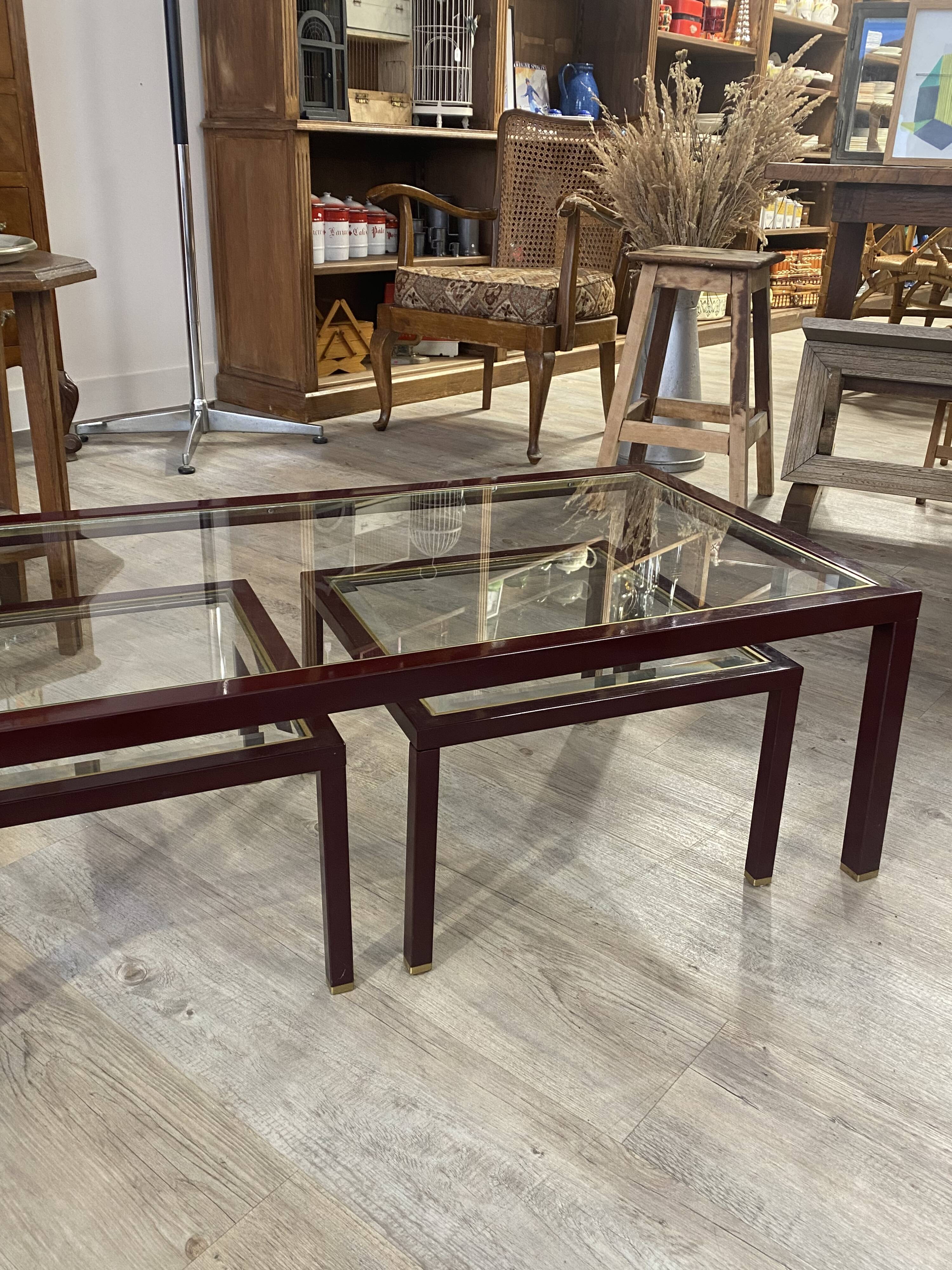 Burgundy lacquered metal, brass and beveled glass nesting tables, France 1950s