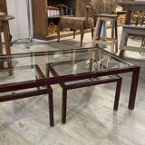 Burgundy lacquered metal, brass and beveled glass nesting tables, France 1950s