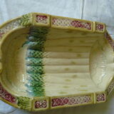 Old asparagus dish in saline slip fixed cradle
