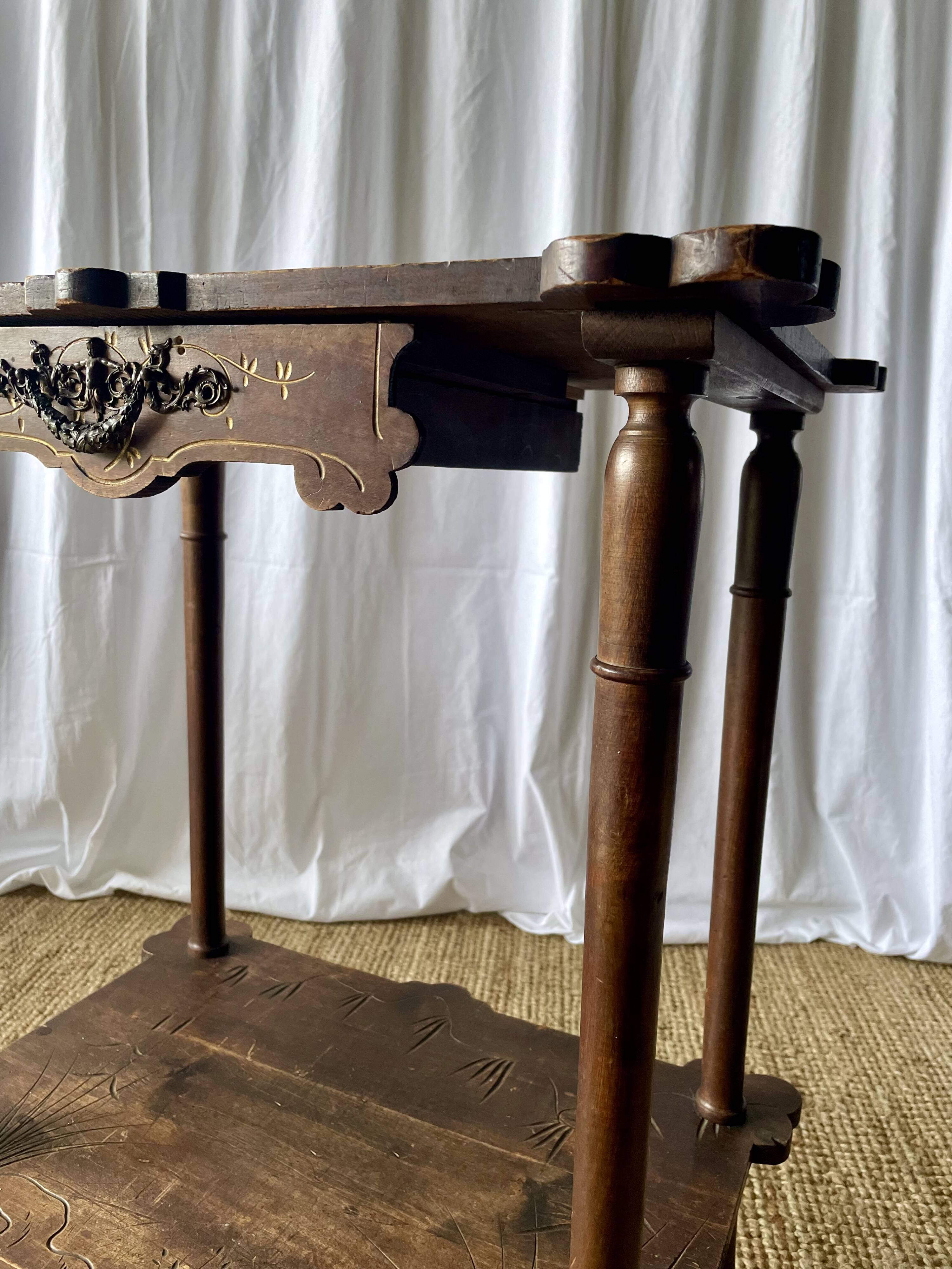 Elegant Art Nouveau side table in walnut, France early 20th century.
