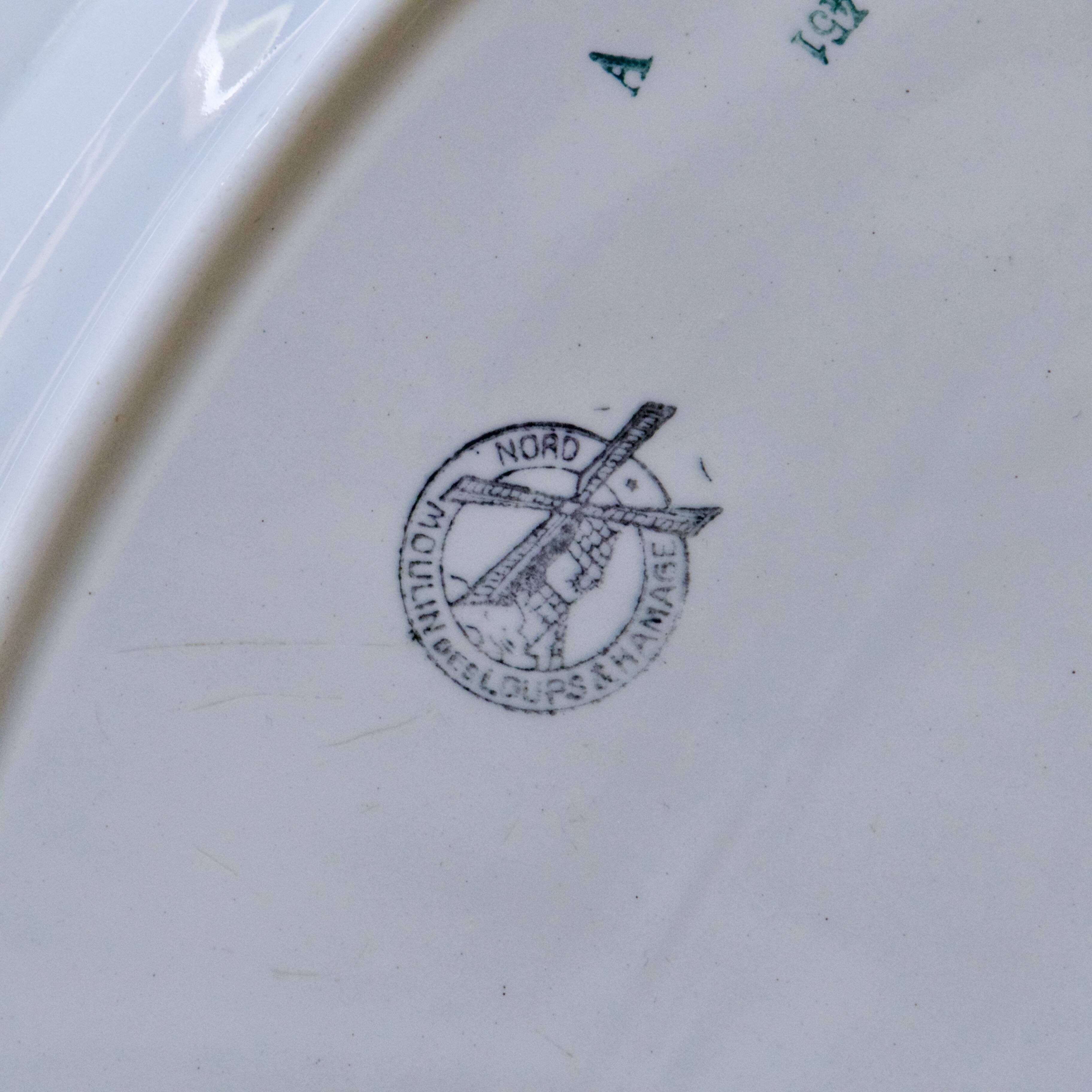 Large oval dish from the 19th century, ironstone, signed Moulin des Loups.