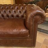 brown leather 2-seater Chesterfield sofa