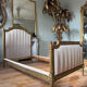Pair of late 19th-century gilded wooden beds in Louis XVI style.