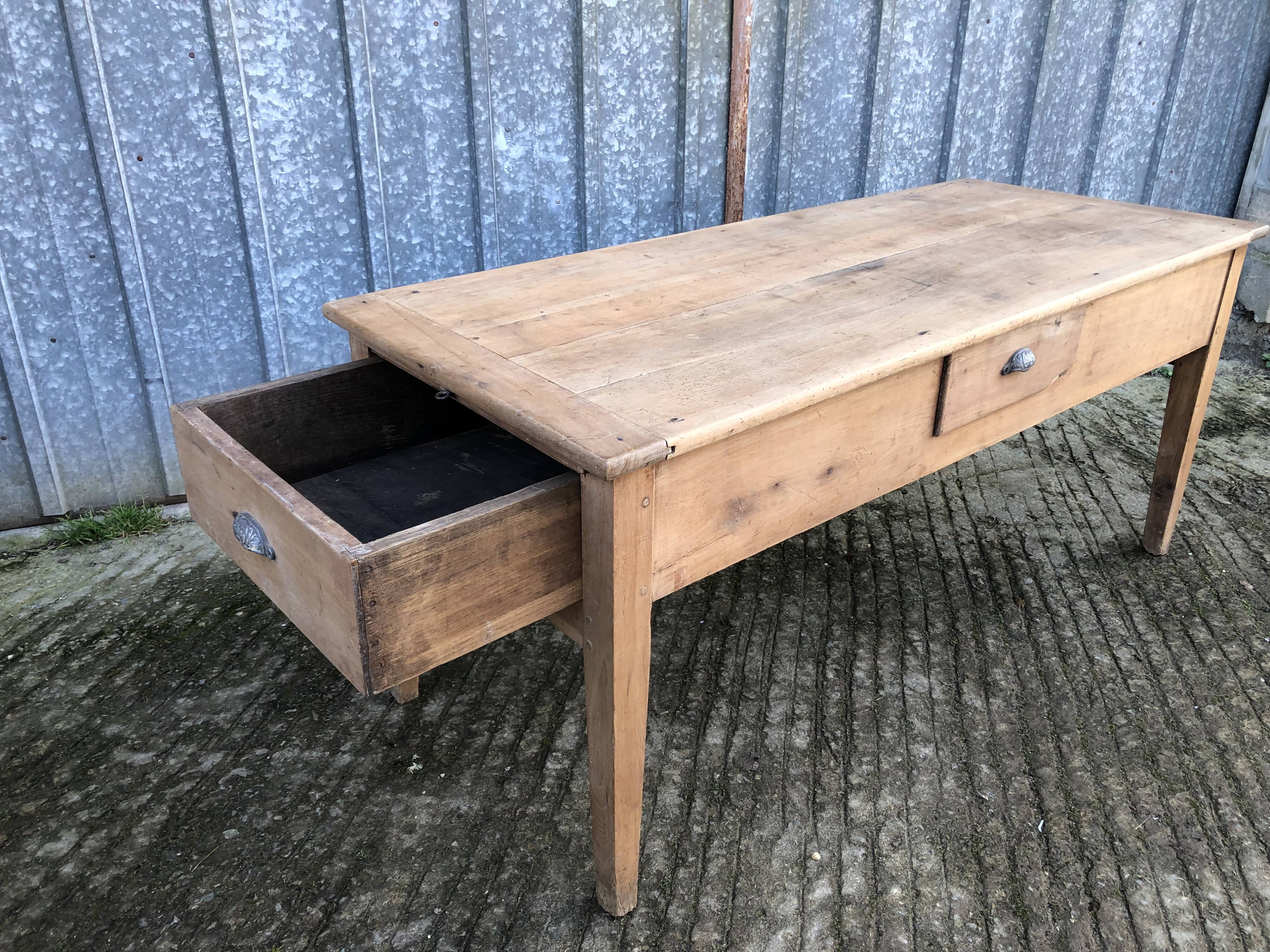Antique solid cherry farmhouse table with 3 drawers and 1 pull out.