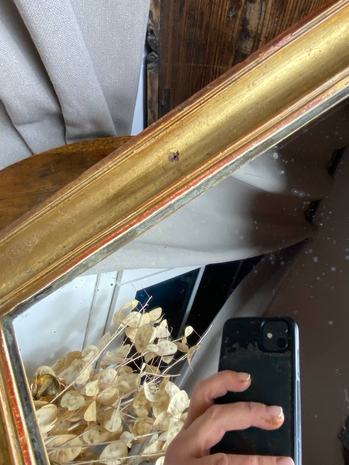 Antique mirror in gilded wood