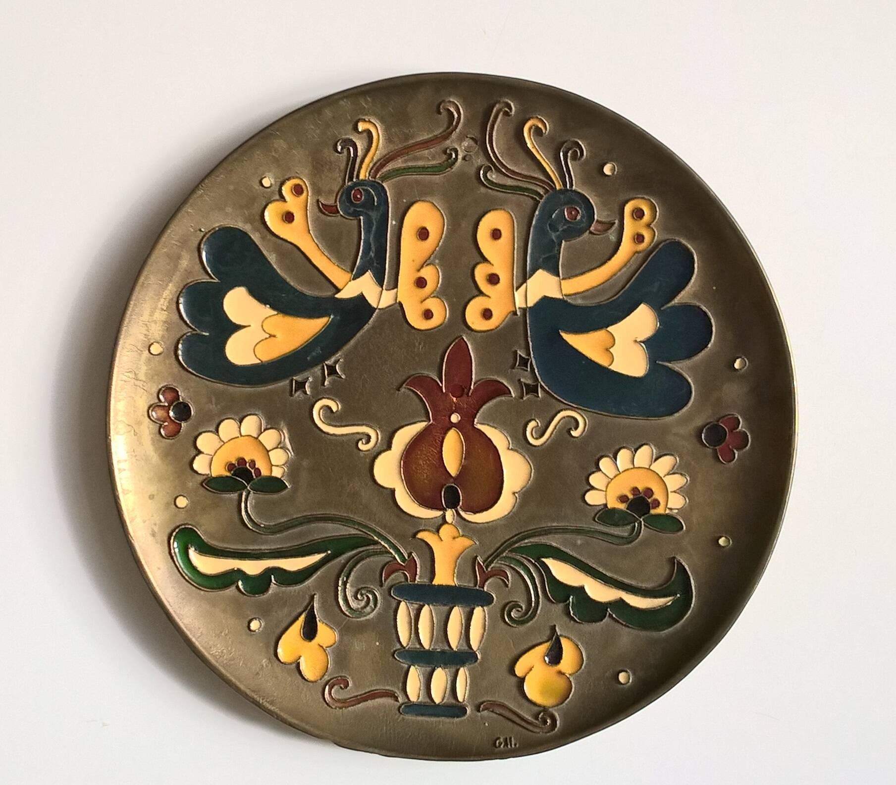 Old decorative brass and enamel wall plate signed GH