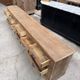 Large workshop furniture transformed into a TV unit.