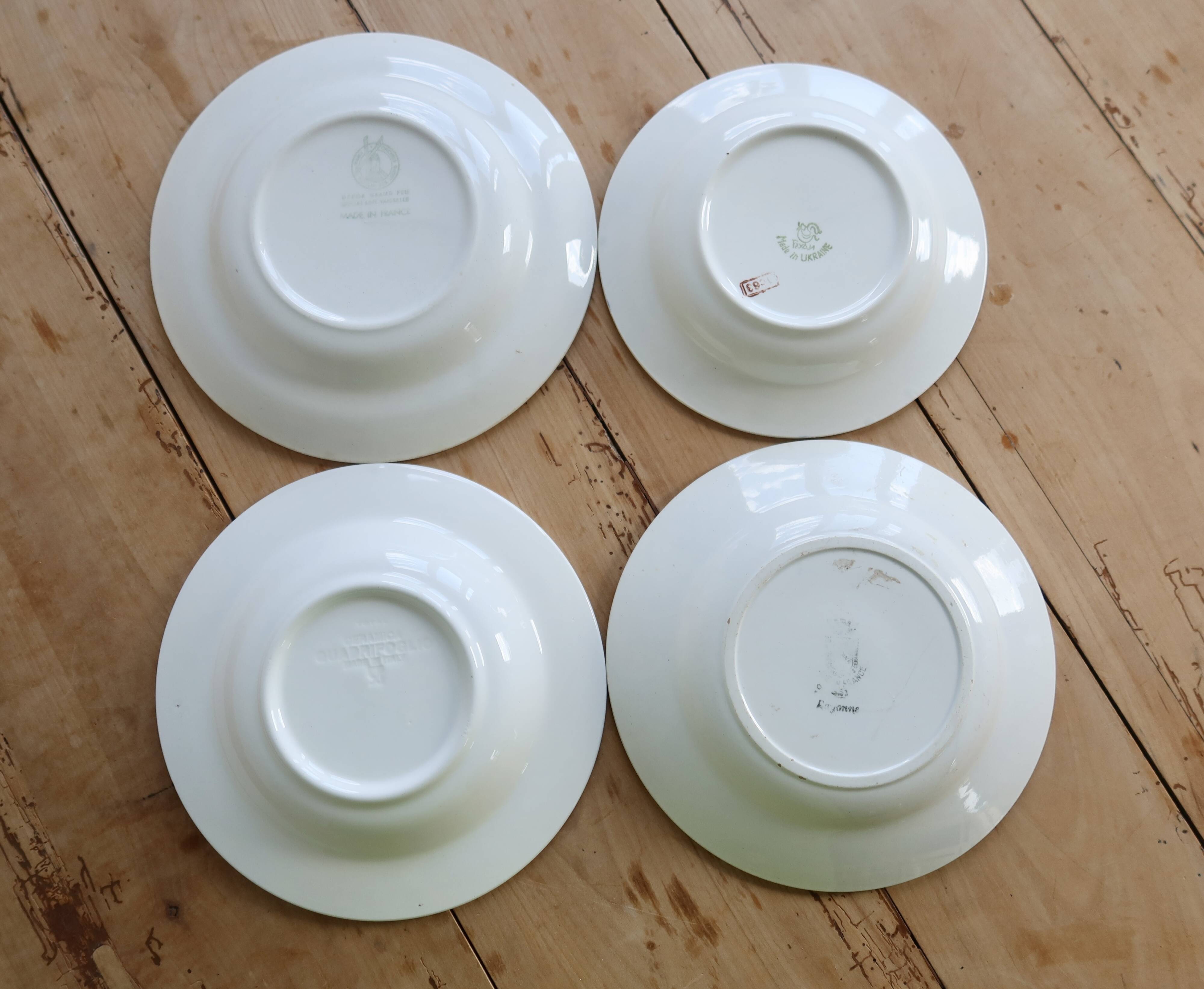 4 mismatched vintage deep plates in blue and white porcelain