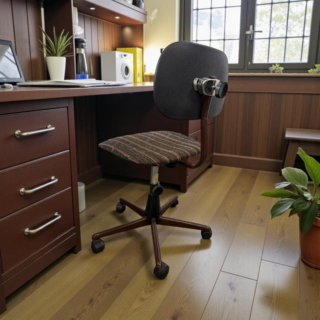 Brown vintage office chair from the 70s on wheels.