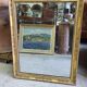 GOLDEN WOODEN MIRROR WITH PALMETTES FROM THE 19TH CENTURY
