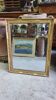 GOLDEN WOODEN MIRROR WITH PALMETTES FROM THE 19TH CENTURY