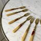 set of 12 horn dessert forks from the 50s