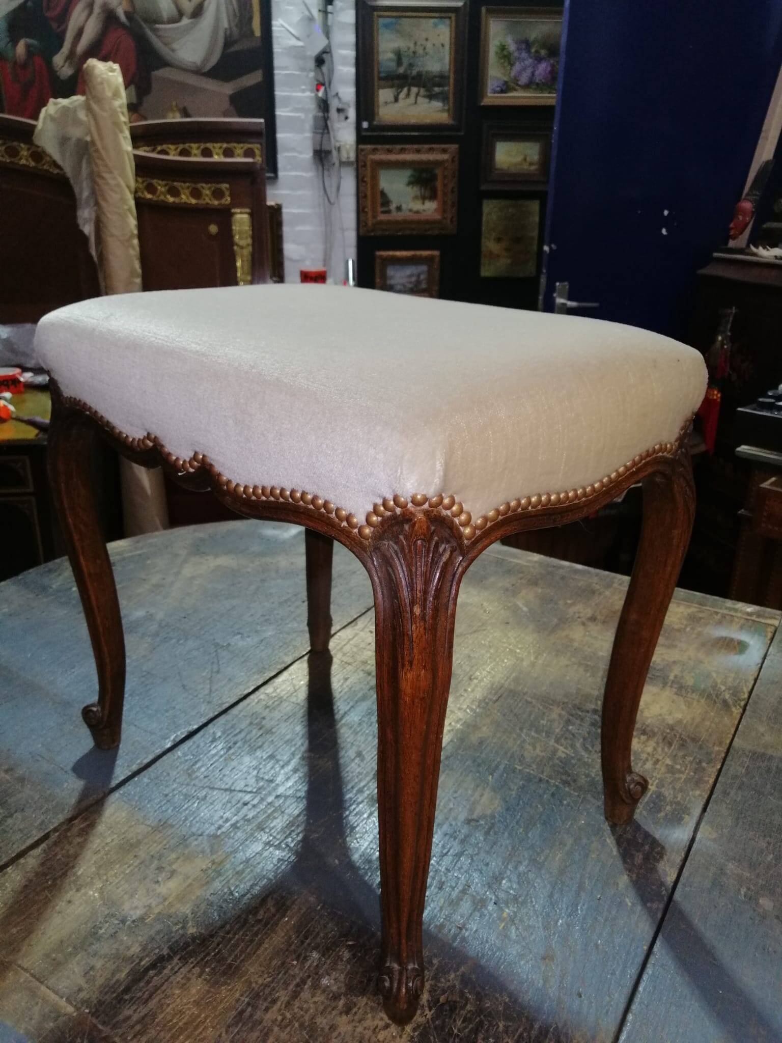 Small Louis XV style bench with curved cabriole legs.