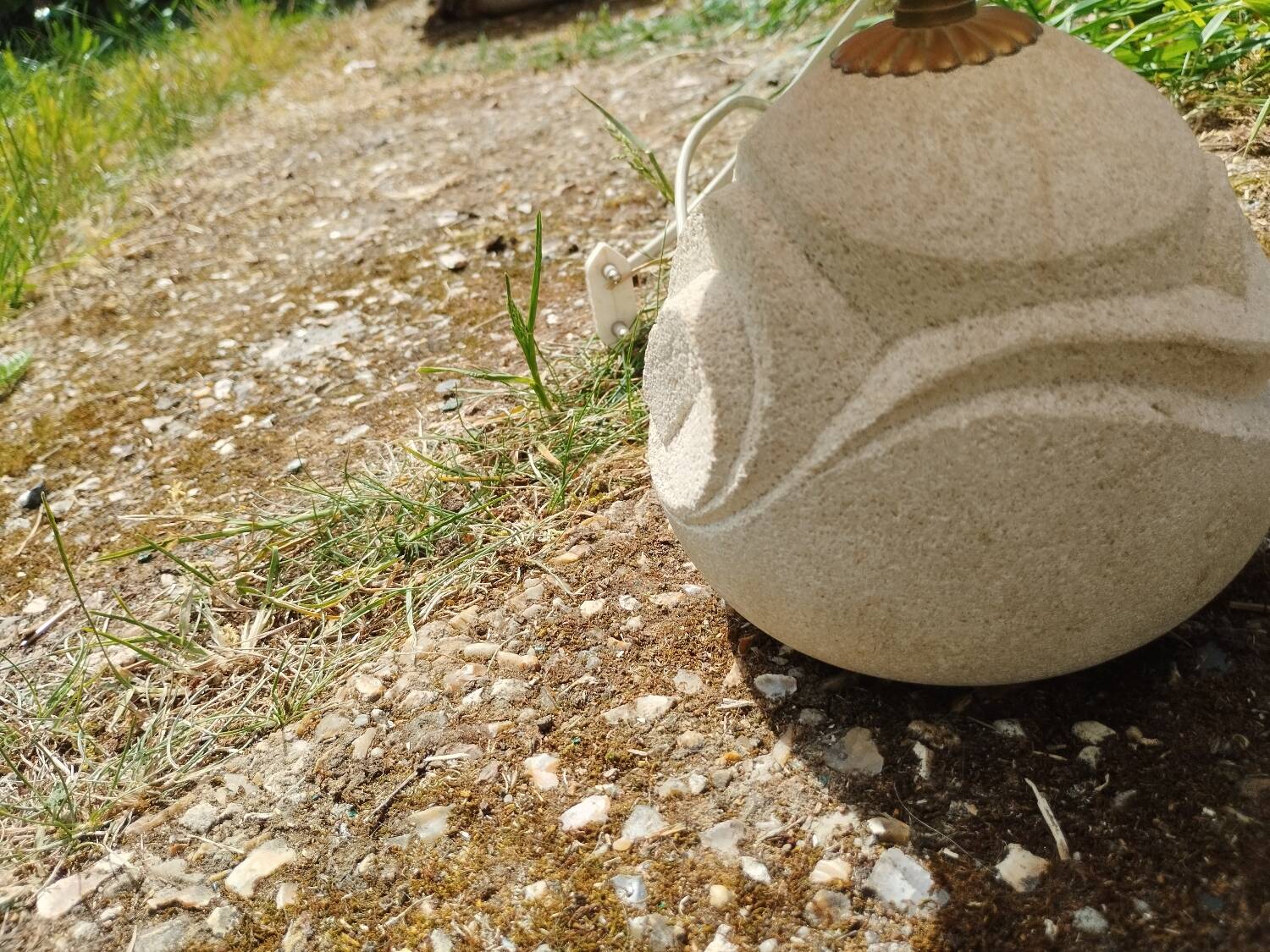 Vintage antique lamp with a stone base.