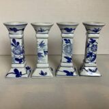 Four candlesticks with blue patterns