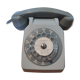 Old vintage wired dial phone with its earphone, gray color. Late 70s - early