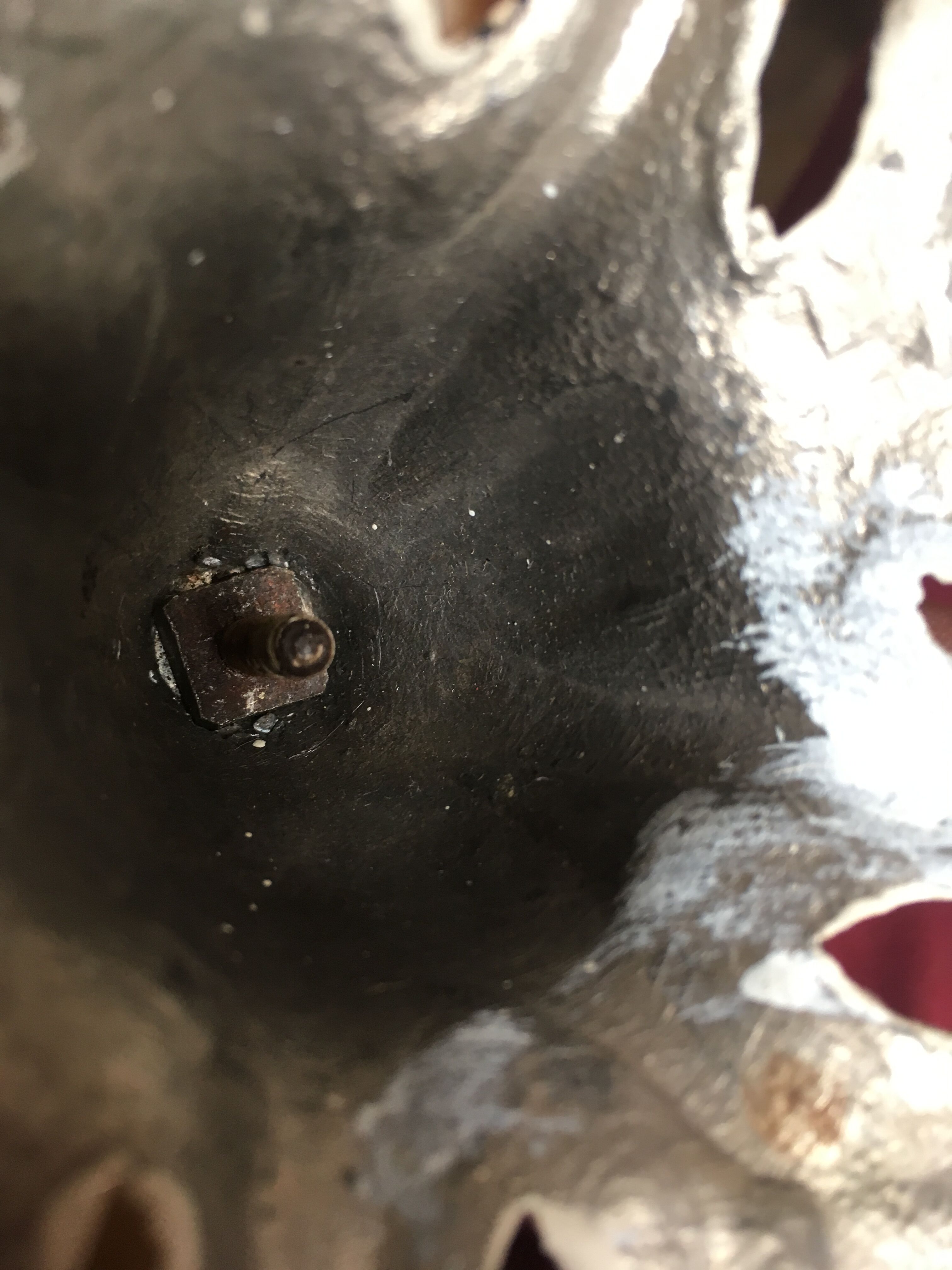 Large candle holder in patinated white painted metal