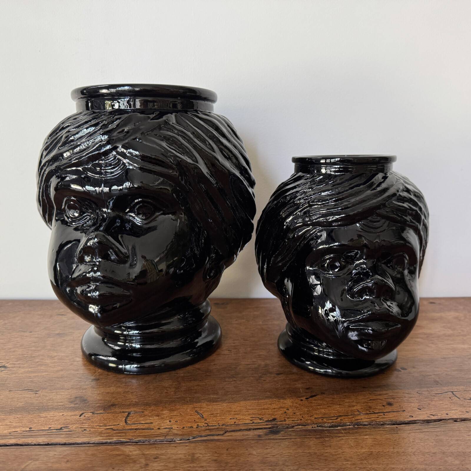 2 glass heads representing Moors