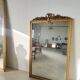 Miroir de cheminée en bois doré à décor de nœud et de roses H : 164 cm