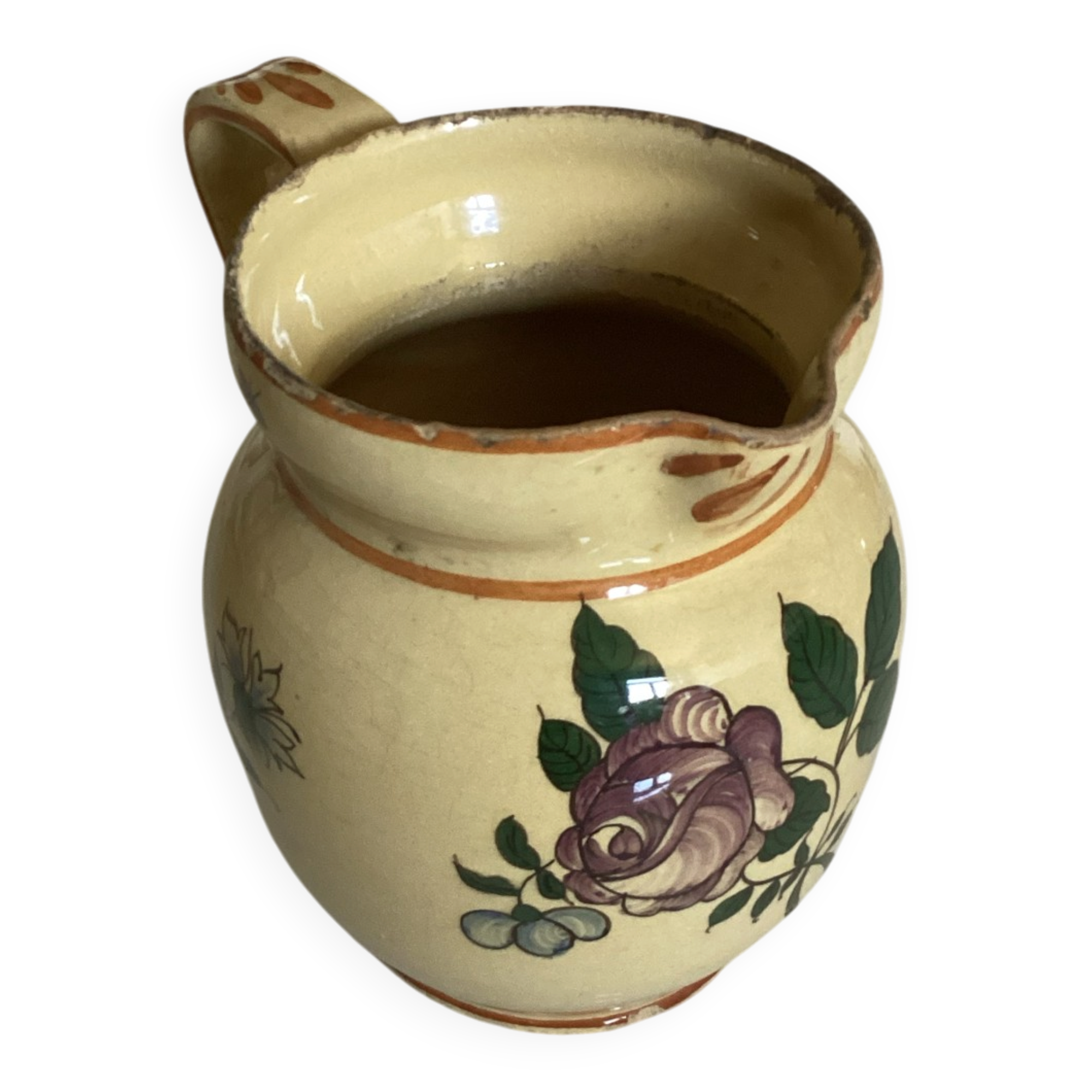 Old ceramic jug with floral decoration