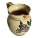 Old ceramic jug with floral decoration