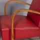 Pair of vintage 1950's armchairs in red leather, italian design