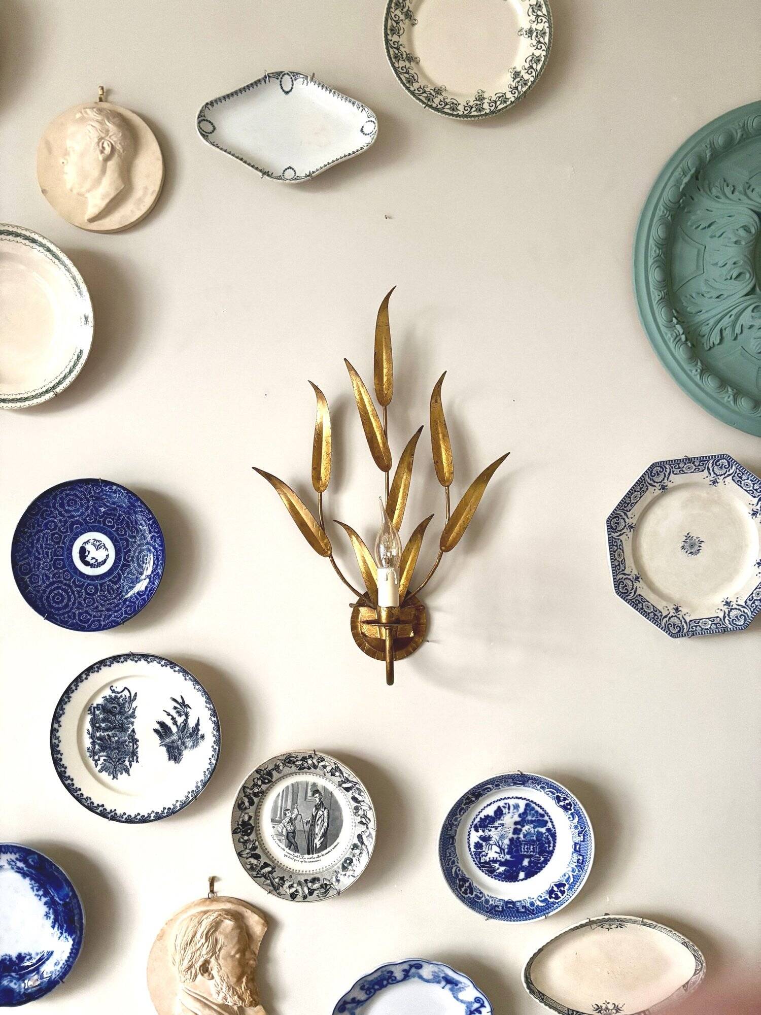 Gold metal leaf wall light