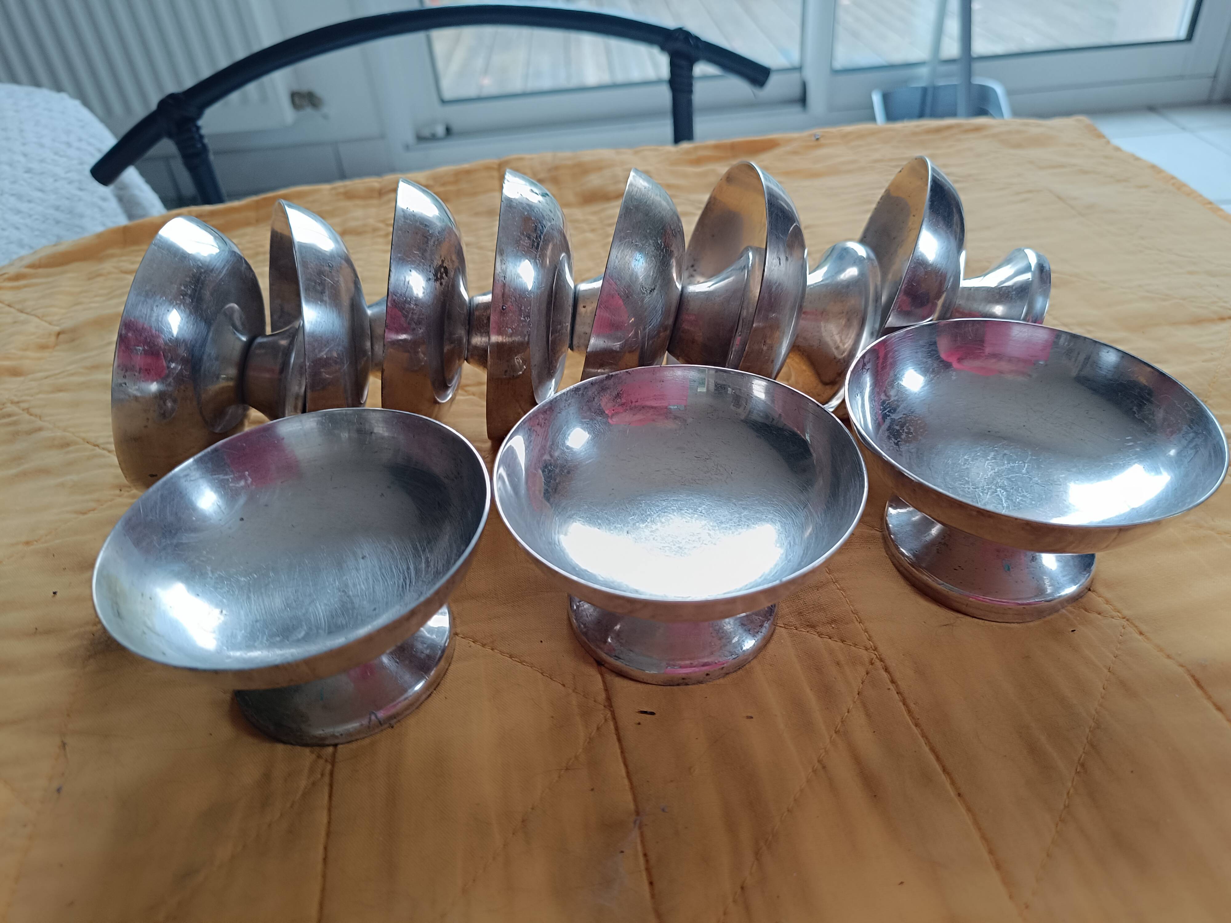 10 Antique silver-plated metal cups.