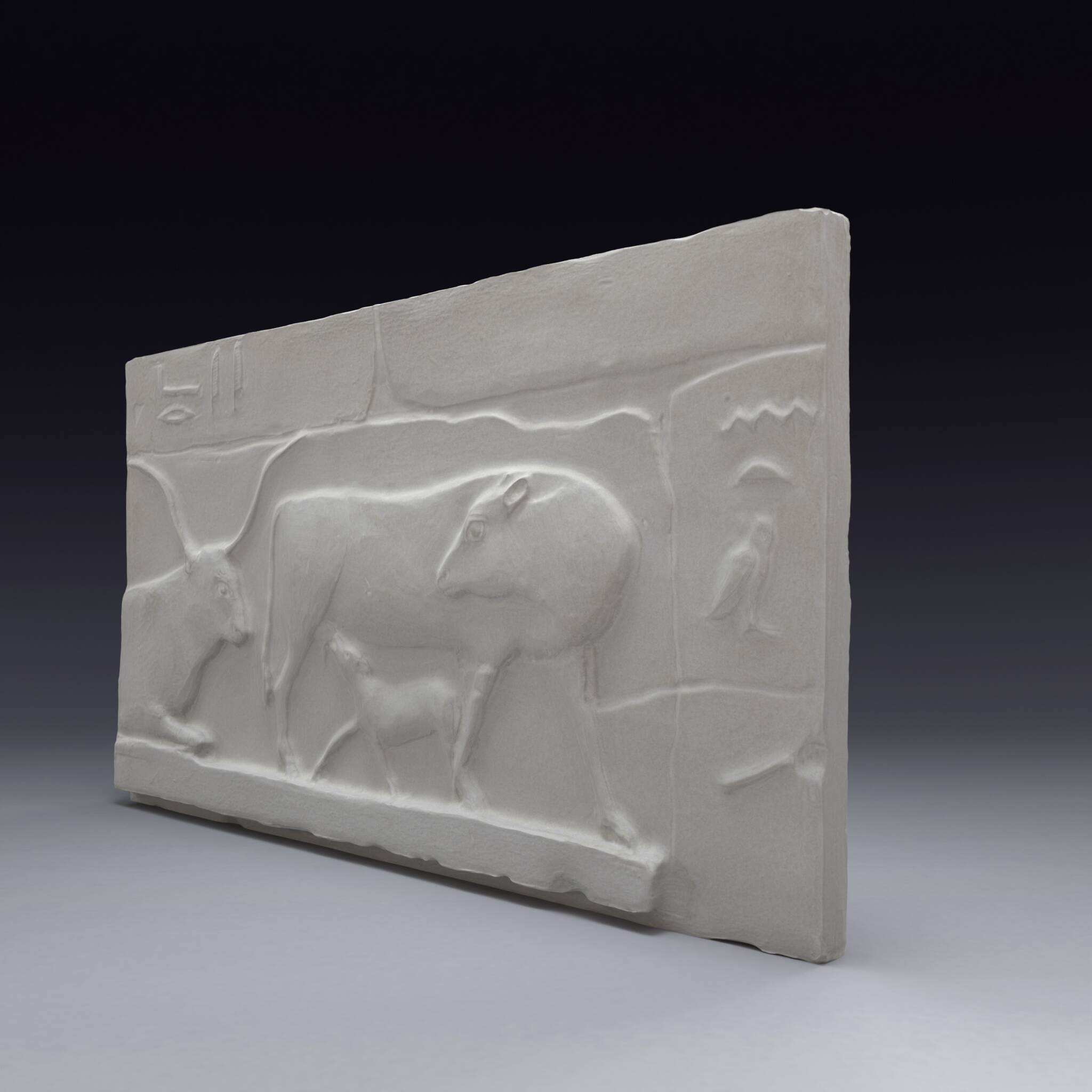Plaster depicting two cows and a calf, based on an Egyptian fresco.