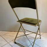 Velvet folding chair with gold metal.