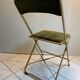 Velvet folding chair with gold metal.