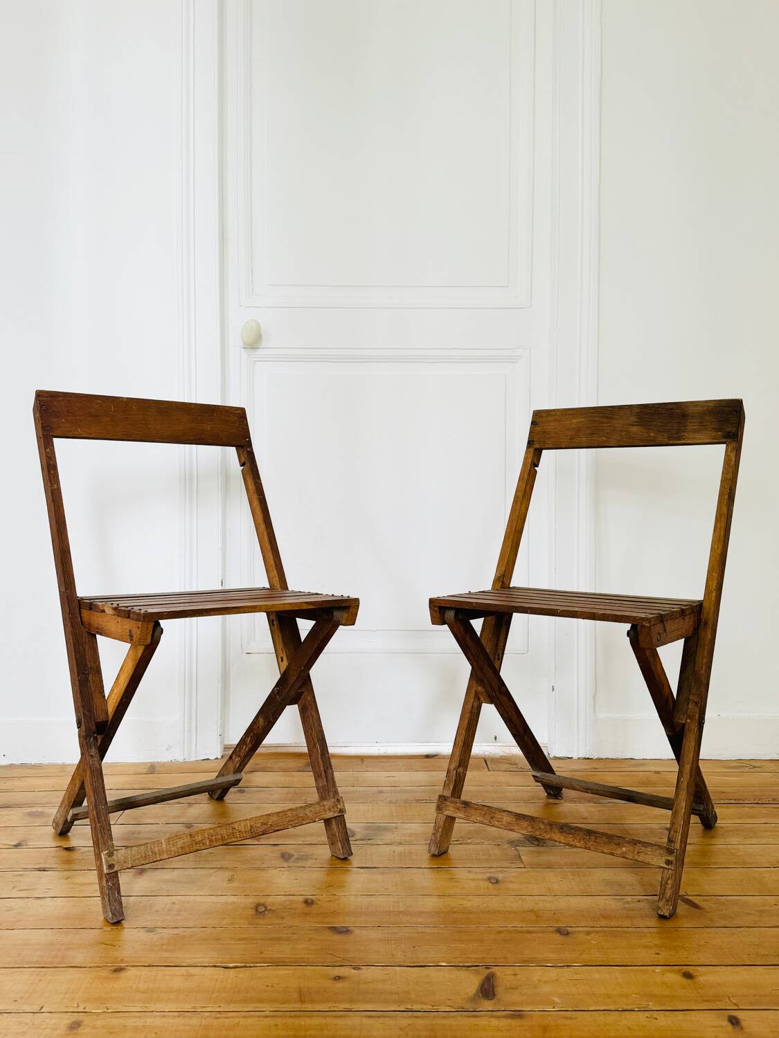 Two vintage wooden folding chairs, circa 1960
