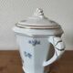 Antique porcelain sugar bowl with a decagonal base.